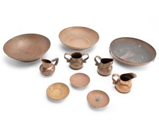1174
A Group Of Hector Aguilar Copper Items
Circa 1940s; Taxco, Mexico
Each stamped for Hector Aguilar: HA; Some further stamped: Taxco / Mexico / 994
Comprising three ball-footed dishes, two mixed-metal bowls, two cream jugs, one cream jug with wood handle, one sugar bowl, and one two-ring handled bowl, 10 pieces
Largest: 2.75" H x 12" Dia.
Estimate: $400 - $600
