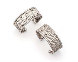1186
A Pair Of William Spratling Silver Cuff Bracelets
Both 1940-1944; First Design Period; Taxco, Mexico
Stamped for William Spratling; Further stamped: Made in Mexico / Silver
Each designed with a linear zig-zag motif terminating with six silver spheres, 2 pieces
Each approximately: 7-7.325" C x 1.125" H, wrist opening 1-1.125"
123.0 grams
Estimate: $800 - $1,200