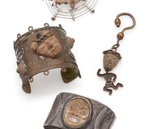 1196
A Group Of Latin American Jewelry Items
20th Century
One stamped: Maya / Mexico; One stamped: Laffi / Peru
Comprising a Maya Mexico figural pendant (4.625" H x 1" W), a Graziella Laffi brooch with pottery animal (2.625" H x 3" W), a Mexican brass cuff with pottery head (7.25" C x 2.75" H, wrist opening: 1.325"), and a cuff bracelet set with pottery head with abalone teeth (8" C x 1.625" H, wrist opening: 1.25"), 4 pieces
Estimate: $400 - $600