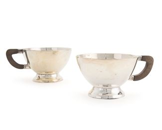 1200
A Set Of Los Castillo Sterling Silver Teacups
Fourth-quarter 20th Century; Taxco, Mexico
Each stamped: Los Castillo (eagle 15) Taxco / [Eagle 15] / Sterling / Made in Mexico
Each cup issuing a carved rosewood handle, 10 pieces
Each approximately: 2.25" H x 4" W x 3" D
51.165 gross oz. troy approximately
Estimate: $1,000 - $1,500