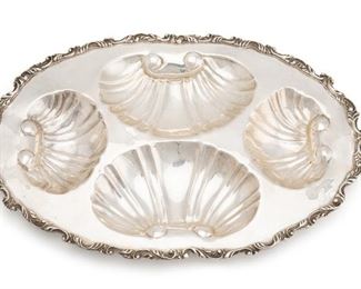 1199
A Pair Of Mexican Sterling Silver Trays
First-half 20th Century; Mexico
One stamped: Sterling / 925
Each tray with four recessed shell compartments and ornate rim, 2 pieces
Each approximately: 1.25" H x 17" W x 11.5" D
71.470 oz. troy approximately
Estimate: $1,000 - $1,500