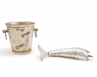 1204
Two Los Castillo Silverplate Fish Items
Circa 1950s; Taxco, Mexico
Each stamped: Los Castillo / Taxco; One further stamped: Hecho A Mano / Mexico
Comprising a two-handled bucket with applied silver and abalone fish motif and a reticulated fish bottle opener with shell eyes, 2 pieces
Bucket: 4.25" H x 5.25" W x 4.125" D; Fish: 1" H x 8.25" W x 2.75" D
Estimate: $300 - $500
