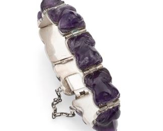1217
A Sanborns Silver And Amethyst Hinged Bracelet
Circa 1948; Mexico City, Mexico
Stamped: Sanborns Mexico; Further stamped: Sterling; Design attributed to Fred Davis / Eagle 22
Designed with eight carved amethyst frog links
6.5" C x .5" H
60.0 grams
Estimate: $300 - $500