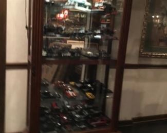 Cars in display lighted cabinet 