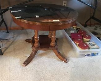 Round glass top 4 leg table with shelf at bottom