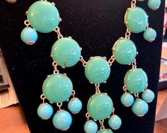 Close up of aqua statement necklace.