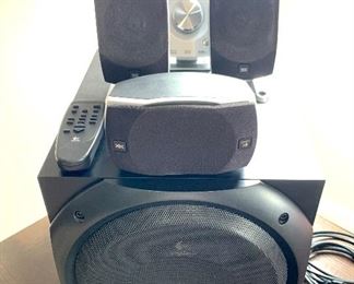 Logitech speaker system.  There are 2 additional speakers that require your removal.