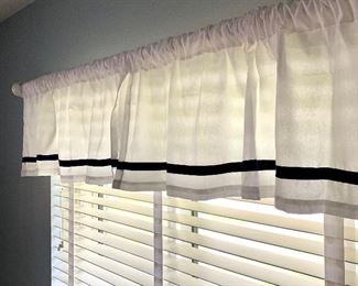 There are two sets of these valances.  Rods and brackets included.  You remove.
