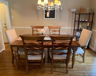 Alternate view of dining room table and chairs.