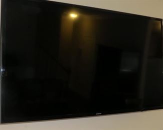 WALL MOUNTED TV.