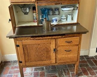 Sellers Hoosier cabinet.  We found the glass jar that goes with it.   The top is copper.