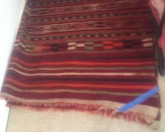 Hand woven rug with some damage