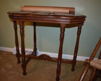 Antique 19th Century table featuring irregular rectangle shaping and Spool style legs