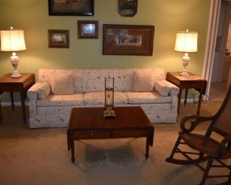A snap shot of Gorgeous Sofa, and Framed Antique Prints. To the sides and front of the Sofa is Kentucky Colonial Style Furniture. This Magnificent Drop Leaf Style Set of Occasional Table and 2 Side Tables was hand made in the 1950's by Ralph Jordan, founder of the Kentucky Colonial Furniture Company.