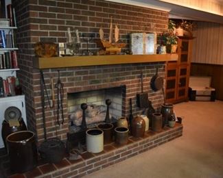 Fireplace Mantle contains many, many Collectibles from a large variety of Antique Crocks to Primitive Iron to Lamps to even an hand made Wooden Boat purchased in Japan in the late 40's.