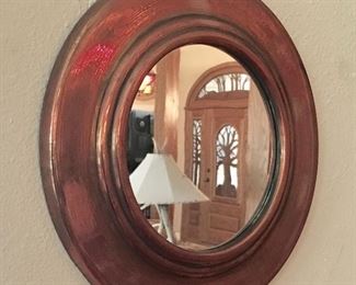 Small Copper round framed mirror.