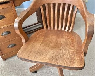 $95 Wood swivel desk chair.  34"H x 24"D x 23"W