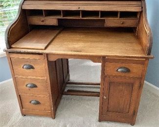 Vintage four drawer and one cabinet roll top desk and chair.  45"H x 31"D x 48"W