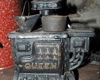 Cast Iron Miniature "Queen" Wood Cook Stove, "Princess" Cook Stove, Balance Scale, Brass Hand Bells, And Cork Sizer