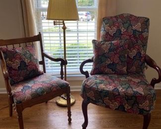 Two Wooden Armchairs and a Floor Lamp