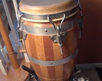 Lots of musical instruments like this vintage wooden conga drum