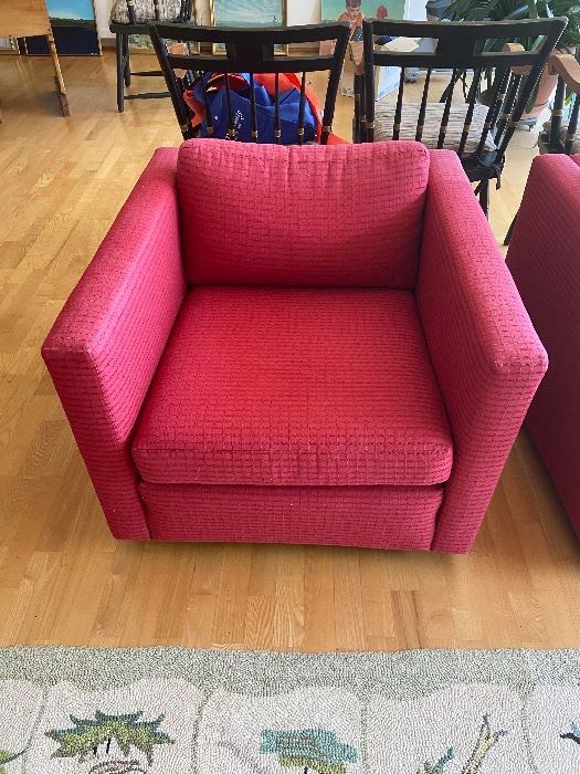 Pair of club chairs, 31.5"w x 33.5"d x 24.5"h. On castors, as found with a bit of fading. Comfy!