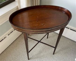 Antique Oval Barrel table with gate leg base made of mahogany  25"w x 15.5"d x 25.5"h $80