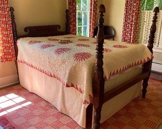 American Victorian empire style four postermahogany bed with ring spool baluster and cup turned posts, scrolled headboard between two headrests.  Mid to late 19th century 59.5"h x 54.5"w.   $250 (mattress and box spring included) 