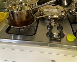 all clad 7 pieces 2 skillets two saucepans three lids asking $140