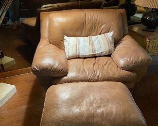 Genuine leather chair and ottoman. Matches other pieces