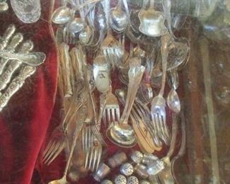 There is a HUGE case of silver plate FANCY flatware- some incredible pieces- many patterns- priced to sell