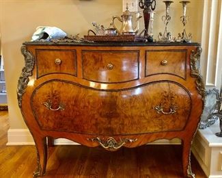Stunning French style commode with ornate bronze mounts, curved legs, and marble slab top.
