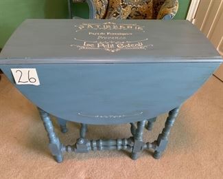 31 inch Gate-leg table Reminiscent of European antiques. Character filled but practical. Has felt foldable table pad. Opens to 40” long. 