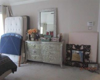 Dresser with mirror.   Twin bed mattress and headboard. 