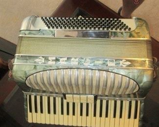 Vintage Accordian.  Appears to be Mother of Pearl inlay.  