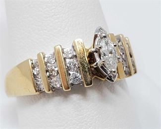 14K Gold Diamond With Marquise Center Diamond and Round outer Diamonds 6g and a size 10.5