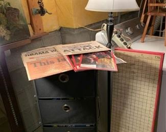 Rolling Drawer, Floor Lamp, Newspapers