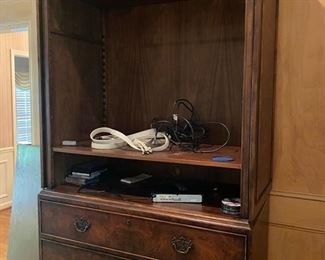 Burl wood entertainment armoire is large and in charge. Three huge drawers of storage and a large cabinet to accommodate most size TVs.