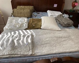 Luxury bedding including king size matelasse duvet and matching shams, dark green silk bolster pillows, white queen size matelasse coverlet, like new electric blanket, Battenburg lace pillow cases and small pillows