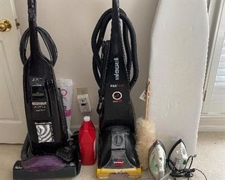 Eureka vacuum cleaner, Bissell carpet cleaner and solution, ironing board, Rowenta iron