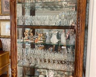 Curio cabinet with sliding door.