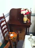table, faux flowers, 1 of 6 matching wicker seat dining chairs