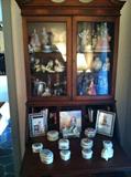 close up of china cabinet and porcelain collectibles