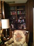 Built-in book case full of books, collectibles, music boxes, and more
