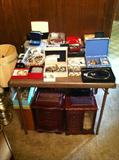 Table full of costume jewelry and several nice jewelry boxes