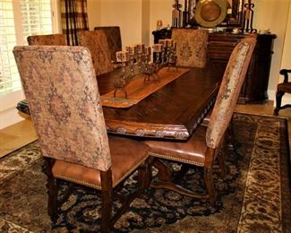 Century Marisol dining table with two twenty-two inch leafs.  Solid wood with decorative finishes.  Leather and upholstered dining chairs.