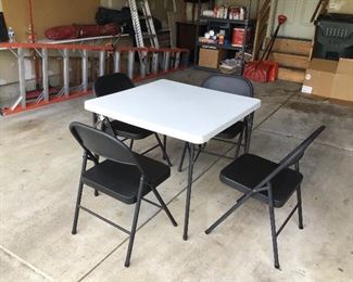 2 white tables and 8 black chairs total  $50 per set