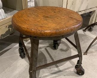 Unusual short Industrial wheeled stool with wood seat
