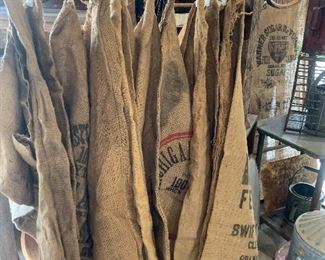 Variety of Antique and vintage dry goods feed sacks 