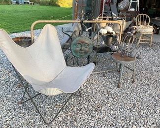 Vintage 1930’s butterfly chairs with newer replacement outdoor covers, vintage garden gate, large metal sun, hypertufa concrete pumpkins 